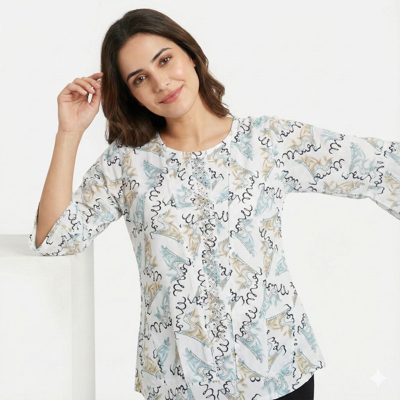 Woman wearing a floral patterned blouse against a white background